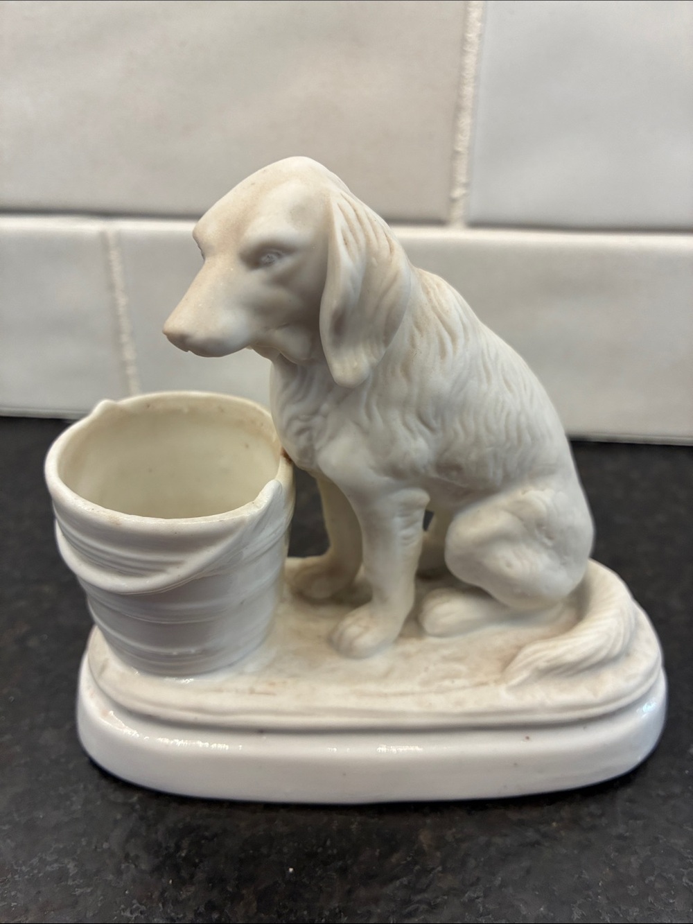 White Ceramic Dog Figurine Parian?  Setter with bucket.